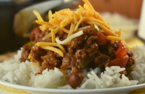 Weeknight Chili in a Skillet, a recipe for chili served over rice will satisfy the hunger of the whole family without hurting your wallet.