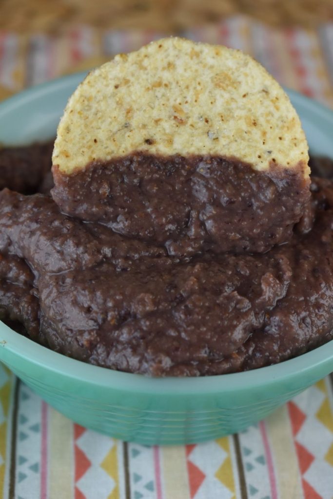 Tortilla chips go perfectly with this easy to make black bean dip.