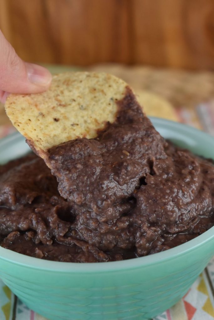 Simple Black Bean Dip is as easy as one, two three.  This pureed black bean dip with 3 ingredients is served cold with raw vegetables, crackers, tortilla chips or as a perfect condiment on a wrap, sandwich or any Mexican dish. 