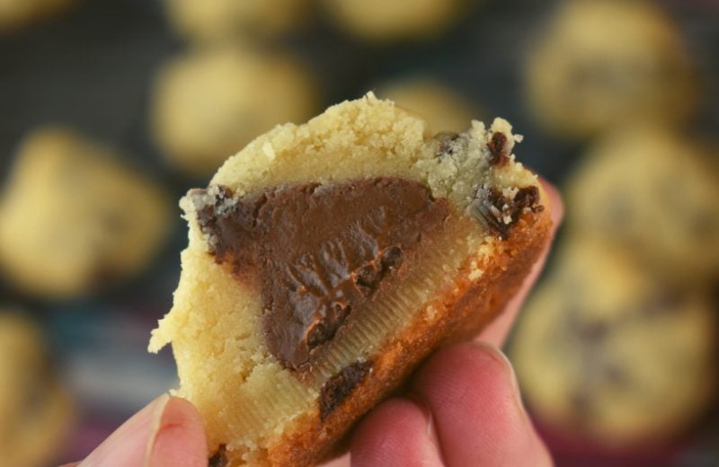 These shortbread  chocolate chip cookies have a secret inside them. Each cookie has a Hershey Kiss inside.