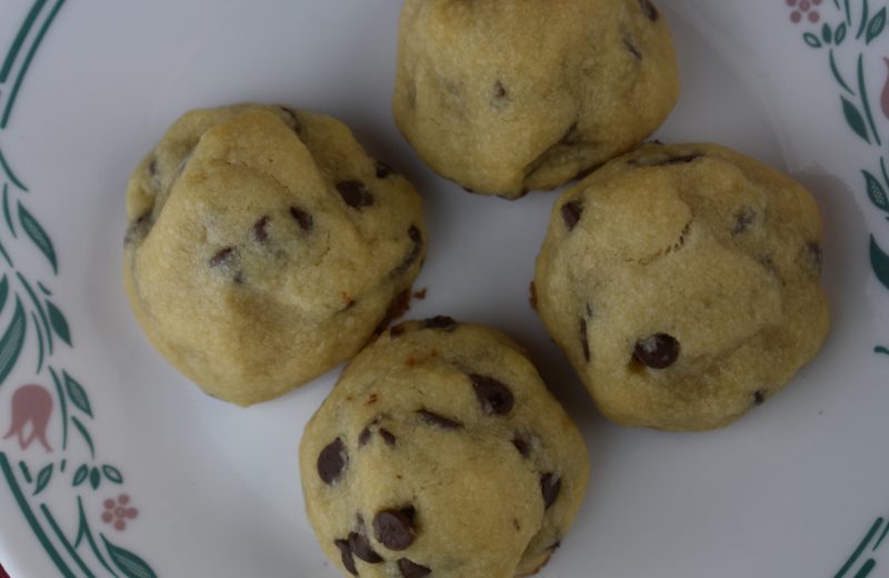 Chocolate Chip Hershey Kiss Cookies have a shortbread texture and flavor and are dotted with mini chocolate chips.  The best part is a hidden Hersey Kiss baked right in the center of each chocolate chip cookie. 