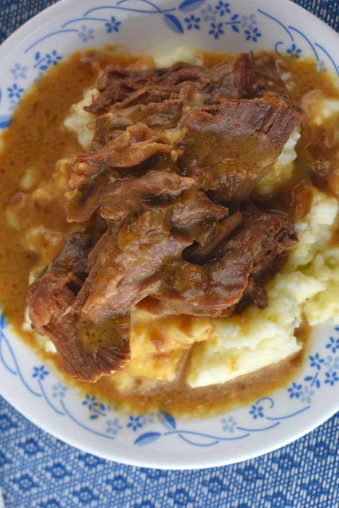 
This Crock Pot Beef Roast and Gravy isn't just a Sunday Roast Beef and Gravy recipe; eat it any day of the week.  It's a moist slow cooker roast beef recipe that tastes great served over mashed potatoes. Plus, it only has 3 ingredients!
