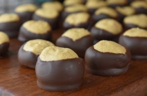 Old Fashioned Peanut Butter Balls is an easy recipe for a plain peanut butter ball.  These classic Christmas candies are also called Buckeye Balls because they resemble an Ohio Buckeye with a peanut butter center covered in chocolate.