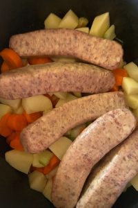 Slow Cooker Bratwurst Casserole is a tasty brat stew recipe with potatoes, carrots, celery, onions and brats stewed in a tasty tomato sauce. This is a great way to use raw, uncooked brats other than on the grill.