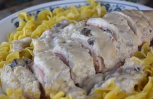 Crock Pot Continental Chicken takes the classic party chicken with cream of mushroom of times past and converts to slow cooking.  With bacon, dried beef and sour cream, this chicken recipe is a winner for dinner. 