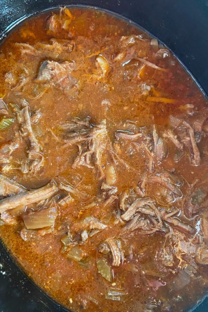 Easy Slow Cooker BBQ Beef creates tasty pulled beef perfect to eat on sandwiches.  Included with this recipe for easy pulled beef are instructions for BBQ shredded beef without the slow cooker.