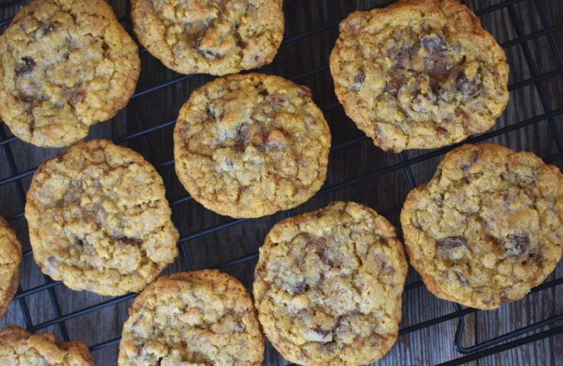 Cowboy Cookies with Toffee Bits contain oats, chocolate chips, and Heath toffee pieces for the perfect cookie. This version of cowboy cookies do not have coconut or nuts in them. These could easily be your new favorite chocolate chip cookie recipe.