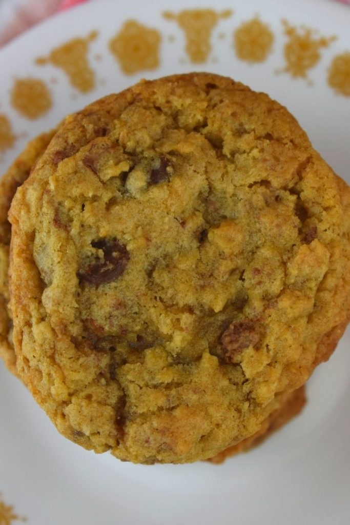 Cowboy Cookies with Toffee Bits contain oats, chocolate chips, and Heath toffee pieces for the perfect cookie. This version of cowboy cookies do not have coconut or nuts in them. These could easily be your new favorite chocolate chip cookie recipe.