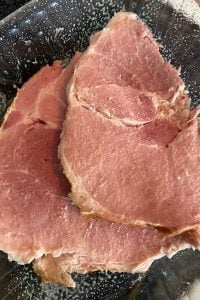 Ham Steak and Potatoes in the Oven is an easy way to get a hearty dinner on the table. Follow these easy instructions for How to Cook Ham Steak in Oven.  Make this a ham steak dinner for two or for a large family.