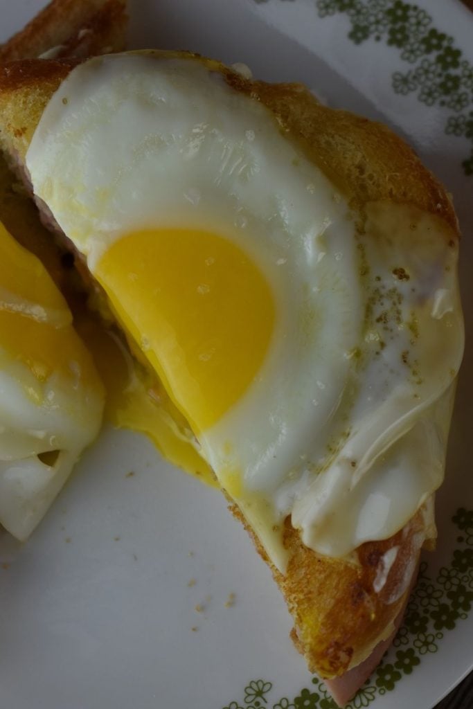 Croque Madame is the same hot ham and cheese sandwich with a runny egg over top.
