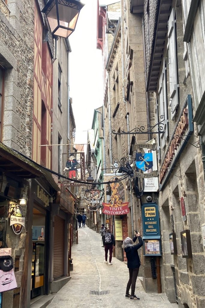 The street going up to the Abbey at Mont St Michel has cute little shops that you'll want to meander through