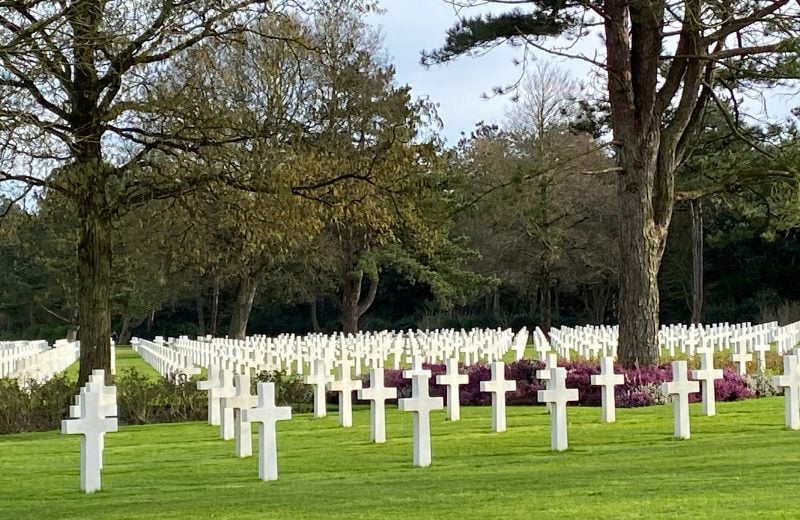 Try to visit the American Cemetery so that you'll be there at 4 pm. This is when a ceremony takes place where two American flags are taken from the poles and folded up.