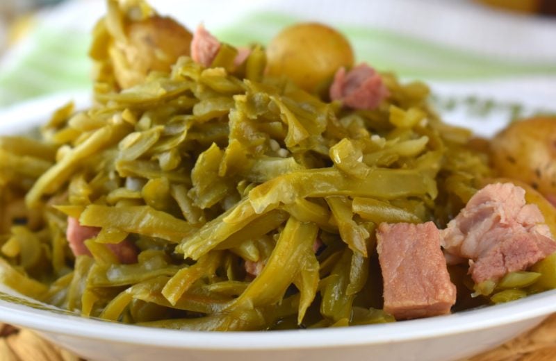 Ham is the perfect accompaniment to green beans. The saltiness of the ham helps to flavor the naturally bland flavor of the green beans. Make this an old fashioned green bean recipe by adding new potatoes too.