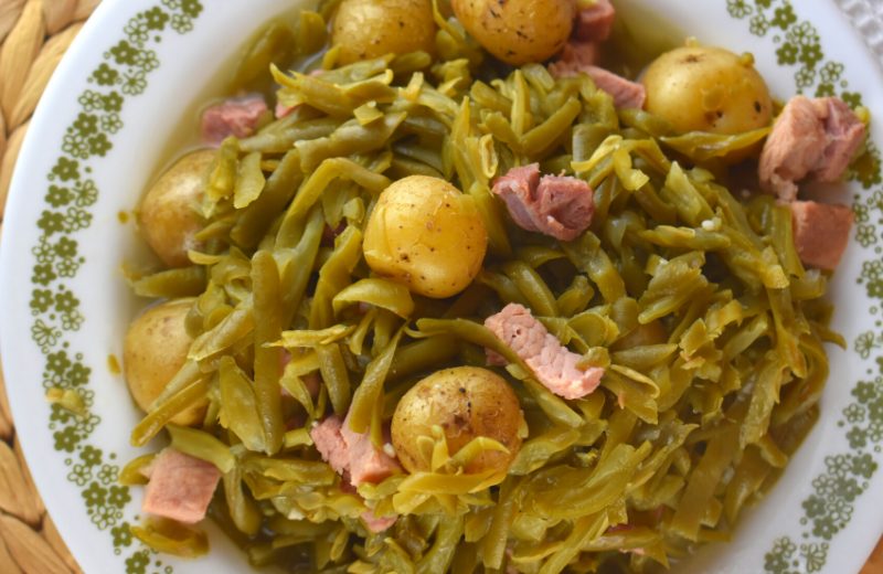 Crock Pot French Style Green Beans is the perfect recipe to bring to any large gathering or holiday event. These slow cooker green beans with potatoes and ham can be put in the crock pot in the morning and are ready for lunch with minimal effort.