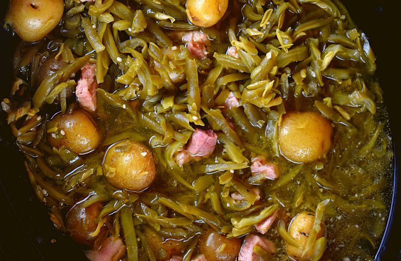 Ham is the perfect accompaniment to green beans. The saltiness of the ham helps to flavor the naturally bland flavor of the green beans. Make this an old fashioned green bean recipe by adding new potatoes too.