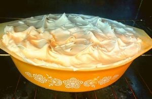 Old Fashioned Banana Pudding is a from scratch vanilla pudding layered with vanilla wafers and bananas and topped with a beautiful meringue.  Baked Banana Pudding with Meringue could also be made with instant pudding for a shortcut recipe.