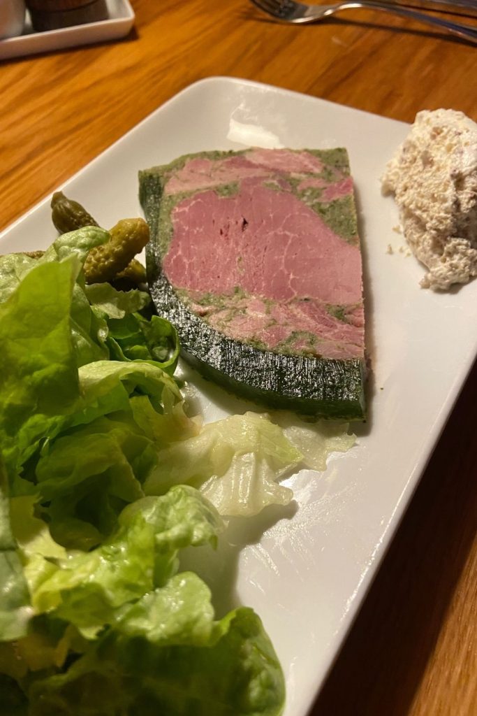 BOURGUIGNON PARSLEY HAM is a classic dish from the Burgundy region. It is a terrine meaning it is a molded meat dish held together by gelatin. This version has tasty country ham and parsley.