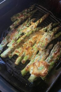 Follow these simple steps for Air Fryer Parmesan Asparagus in less than ten minutes!  Air Fried Parmesan Crusted Asparagus Recipe uses fresh asparagus, mayonnaise, grated Parmesan cheese and black pepper.