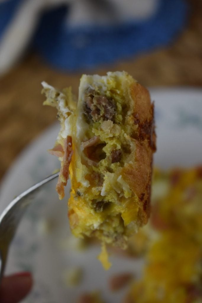 Crescent Roll Breakfast Casserole with Eggs isn't just for breakfast! My family eats this sausage crescent roll casserole for dinner on busy nights.  With a simple crescent roll crust, you can customized the fillings to include breakfast meats, sautéed veggies and you favorite cheese. 