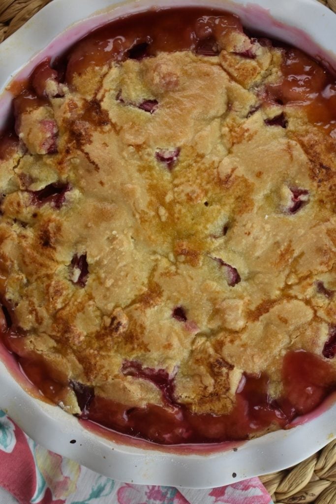No Crust Rhubarb Pie is everything you love about old fashioned rhubarb pie without the crust.  Instead, an easy sweet dough is spread over top. Try this yummy Crustless Rhubarb Pie recipe!