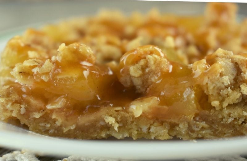 Caramel Apple Crisp Bars are a crowd-pleasing dessert fit to serve that crowd. Apple Crisp Bars with apple pie filling and oats are easy to make, and are glazed with caramel topping. Serve as is or topped with vanilla ice cream. 