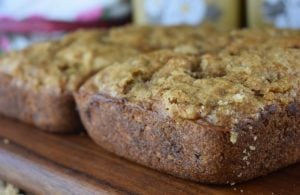 Rhubarb Nut Bread is an old fashioned rhubarb bread recipe with a crumble topping.  This Amish Rhubarb Bread recipe makes two loaves, making it a great recipe to share with friends or freeze for later. 