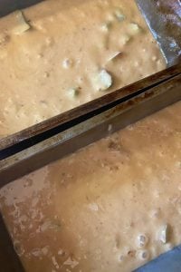 Rhubarb Nut Bread is an old fashioned rhubarb bread recipe with a crumble topping.  This Amish Rhubarb Bread recipe makes two loaves, making it a great recipe to share with friends or freeze for later. 