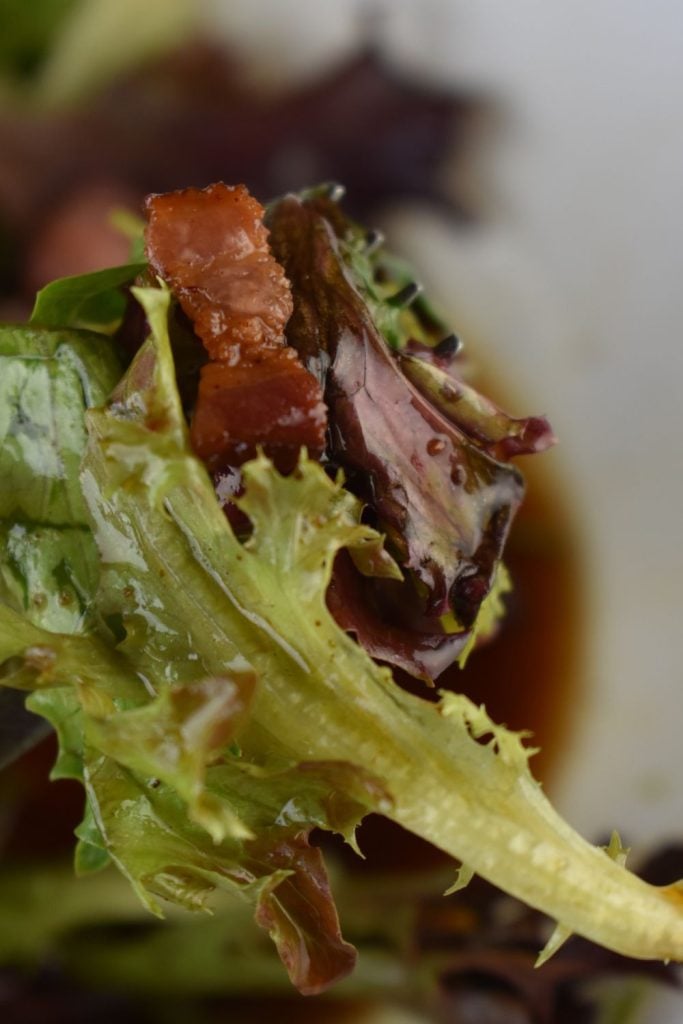 Grandma's Wilted Lettuce Recipe is the perfect summer side dish to take you back to your childhood. Old Fashioned Wilted Lettuce has a hot bacon dressing made with bacon grease, vinegar and sugar. 