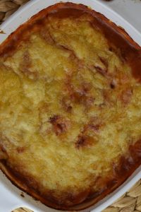 Pizza Potatoes is a pizza scalloped potatoes recipe with a box of scalloped potatoes, pepperoni, canned, diced tomatoes and shredded cheese.