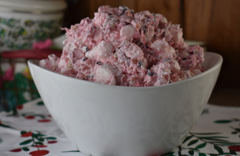 Cranberry Fluff is an old school cranberry salad with fresh cranberries and walnuts. This treat is the perfect holiday side dish to take you back to the good old days.