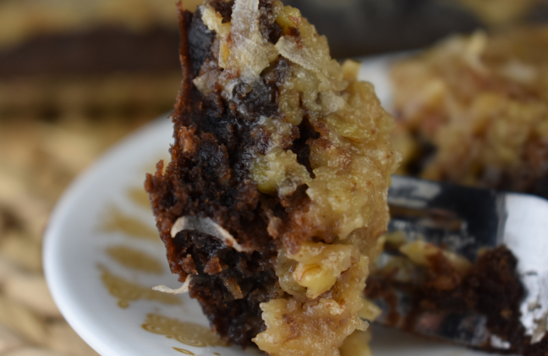 Loaded German Chocolate Brownies not only have that classic icing filled with nuts and coconut on top but also swirled through the gooey center. These German chocolate brownies are made from a box mix.