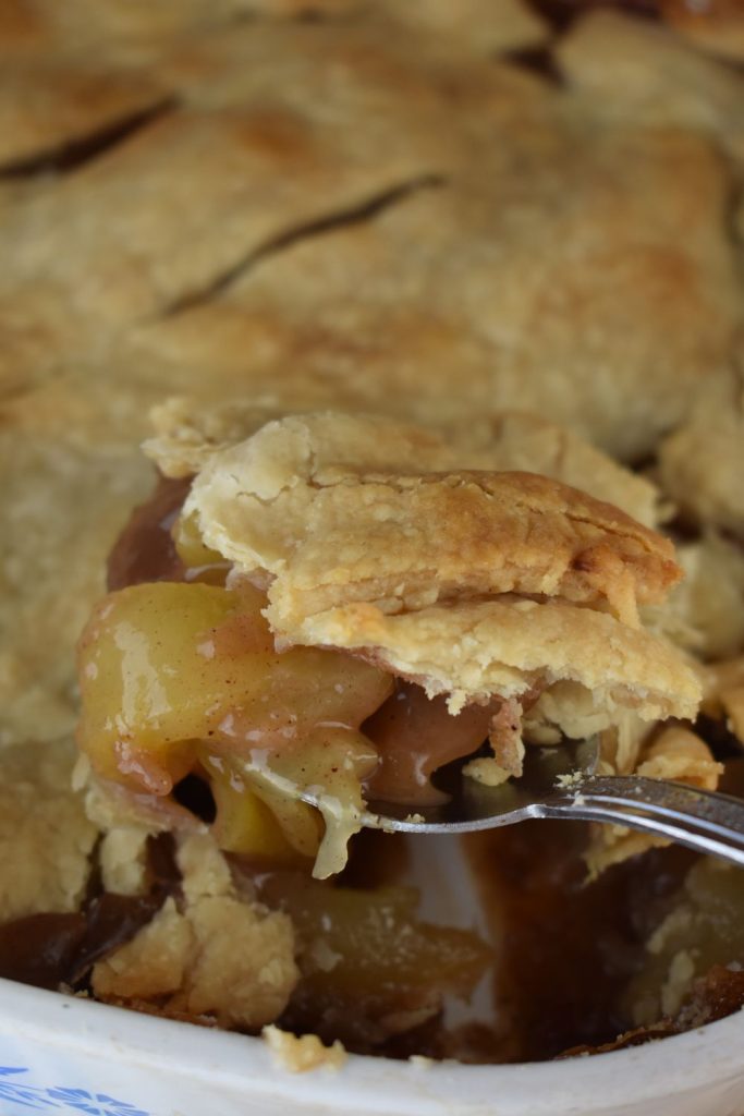 Old Fashioned Deep Dish Apple Pie recipe is an easy way to make apple pie. This apple slab pie has no bottom crust, instead the apples are layered in a 9-inch baking dish with one crust layered over top.