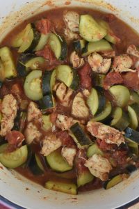 Chicken with Zucchini and Tomatoes is a simple meal full of flavor.  This healthy chicken and zucchini recipe makes a stewed chicken and vegetable dish that gets served over rice. 