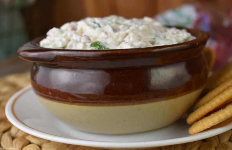 This easy dip recipe is classic picnic food. Radishes, green onions, cream cheese and onion powder create a creamy, white radish dip that goes surprisingly well with sliced meats and cheese.