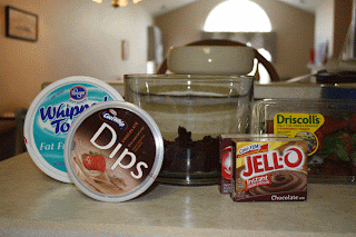 Easy double chocolate trifle ingredients include Cool Whip, brownies, chocolate pudding and strawberries.