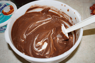 Gently stir in Cool Whip to chocolate pudding mix for the pudding layer of easy double chocolate trifle.