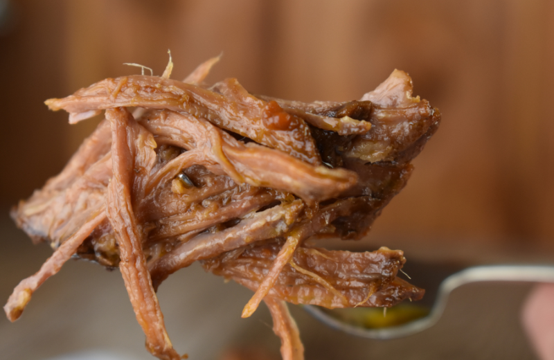 This BBQ beef brisket is slow cooked all day and it falls apart for a perfect forkful of deliciousness.