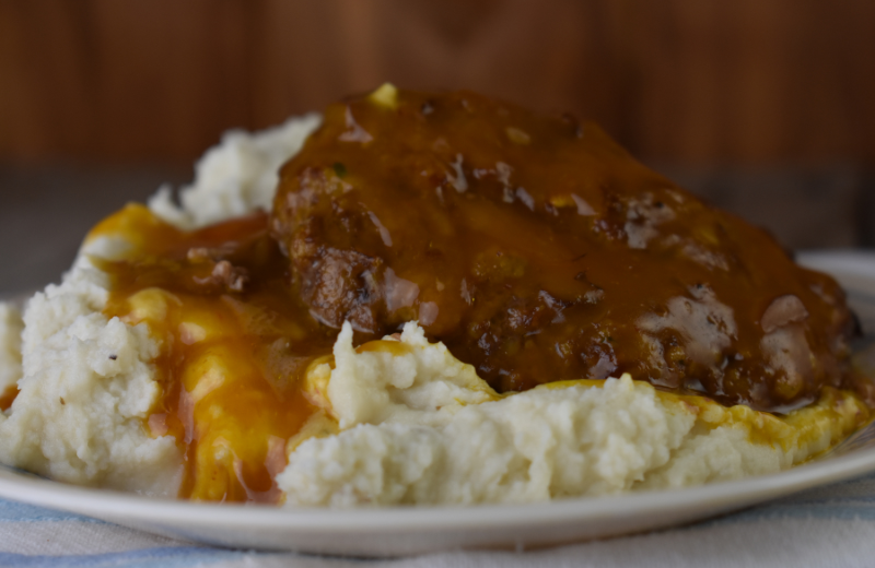 Often served over mashed potatoes, Salisbury steak is an easy to make ground beef patty baked covered by gravy.