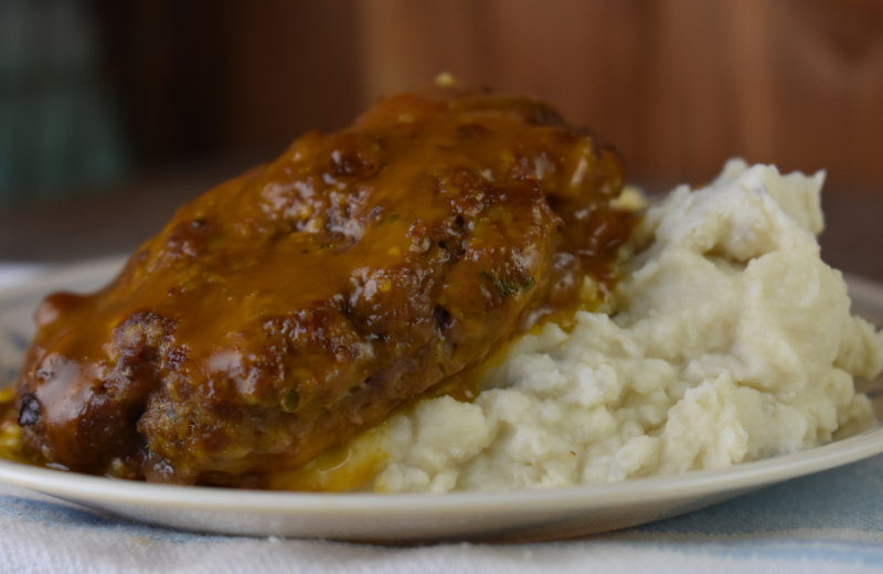 Often served over mashed potatoes, Salisbury steak is an easy to make ground beef patty baked covered by gravy.