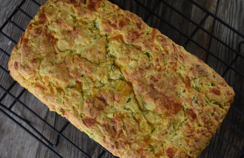 This savory zucchini cheese bread is an easy quick bread full of herbs. This recipe makes one loaf.