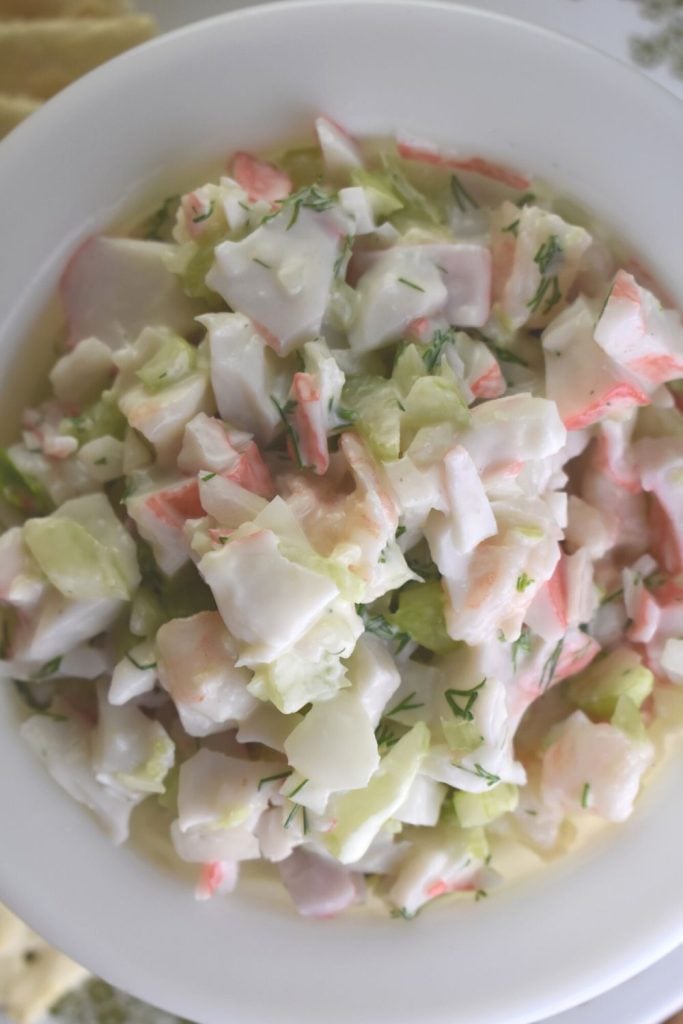 This cold seafood salad has a lovely lemon dressing and features cooked shrimp and imitation crab meat.