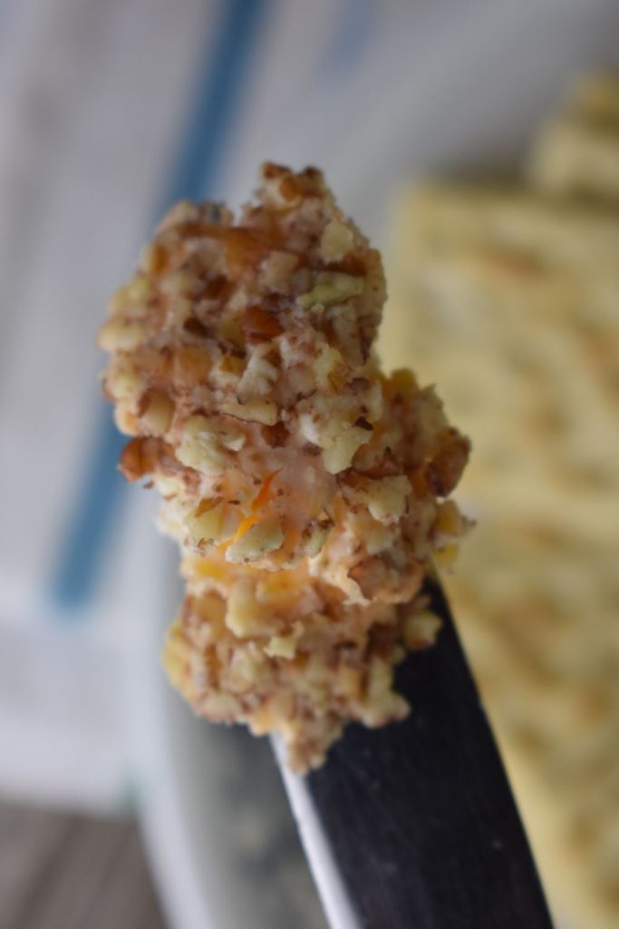 knife with a scoop of cheese ball