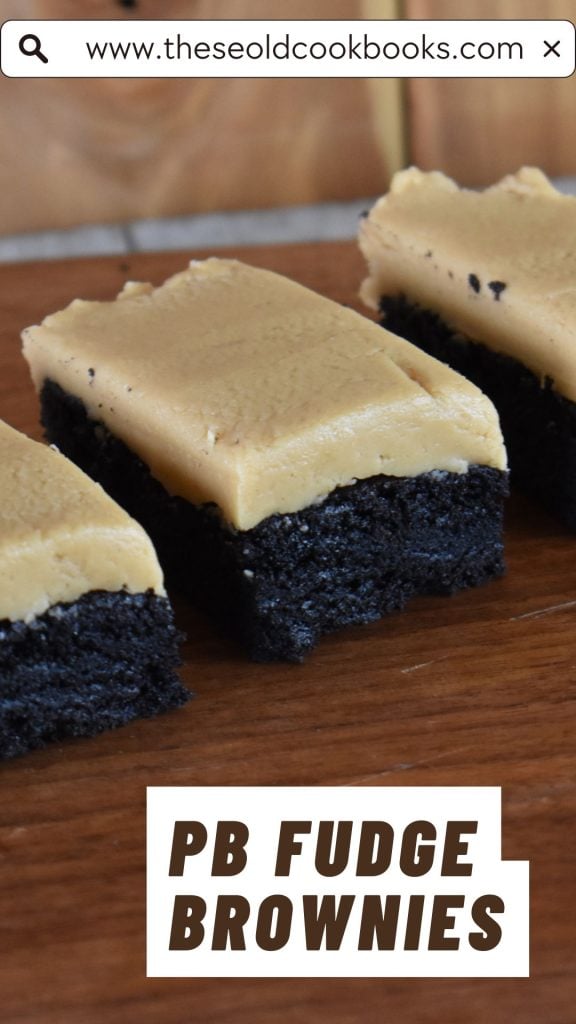 Row of three peanut butter fudge brownies lined up on wooden cutting board