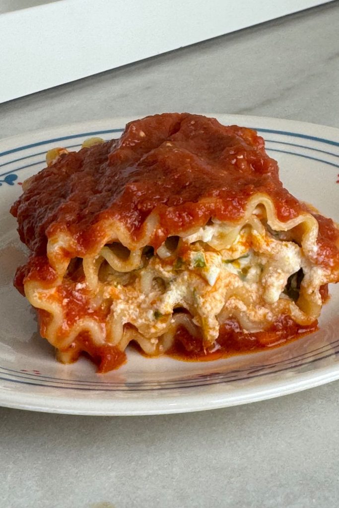 side view of lasagna roll up made with spinach and ricotta