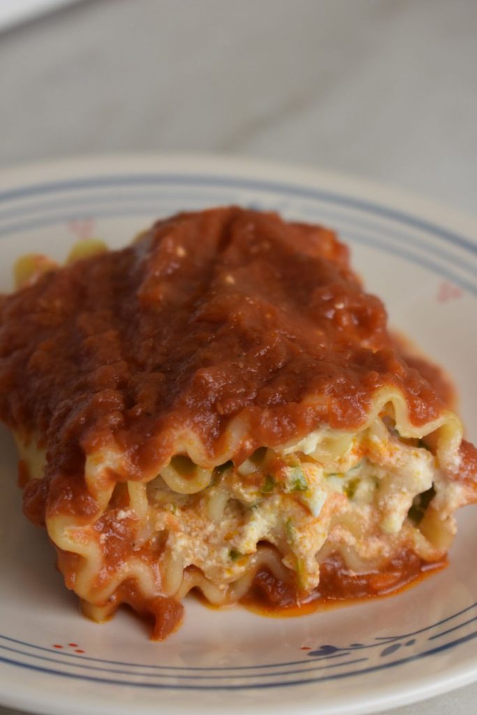 spinach and ricotta lasagna rollup on plate