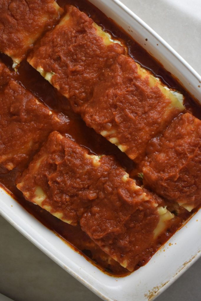 casserole dish of spinach and ricotta lasagna rollups