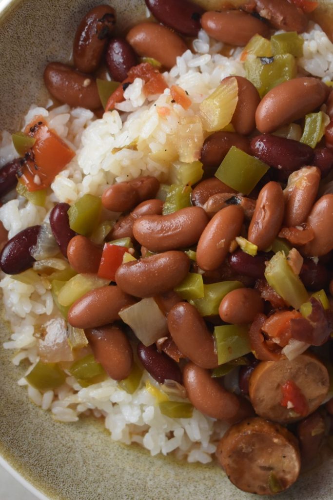This old-fashioned Louisiana red beans and rice recipe is made in the slow cooker with smoked sausage and pantry staples. Easy, comforting, and freezer-friendly.