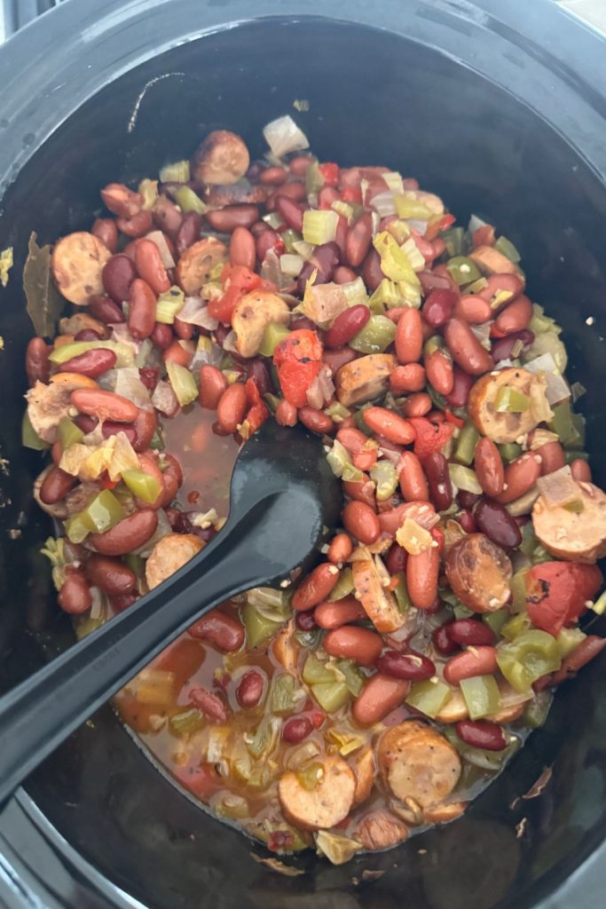 This old-fashioned Louisiana red beans and rice recipe is made in the slow cooker with smoked sausage and pantry staples. Easy, comforting, and freezer-friendly.