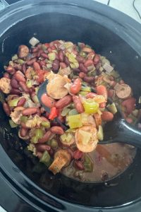 This old-fashioned Louisiana red beans and rice recipe is made in the slow cooker with smoked sausage and pantry staples. Easy, comforting, and freezer-friendly.