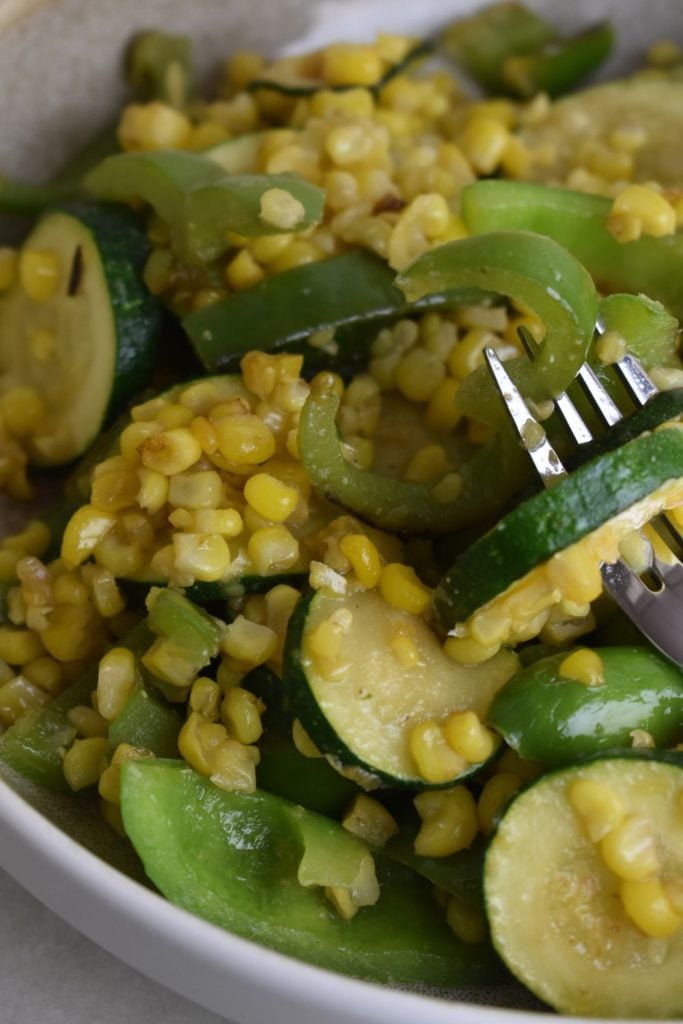 This easy old-fashioned zucchini and corn skillet is a quick 10-minute side dish made with garden zucchini, sweet corn, and peppers.
